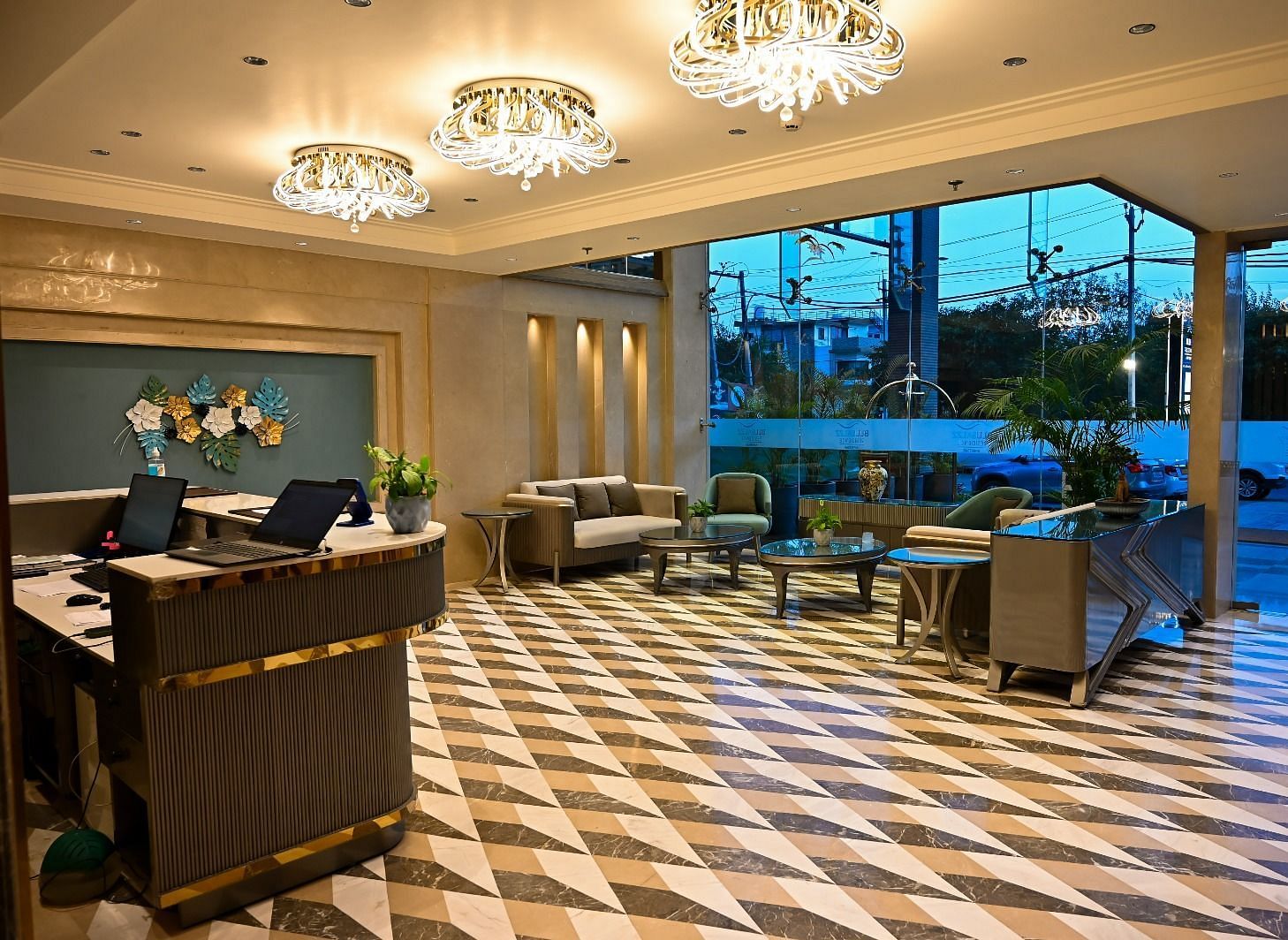 A spacious lobby featuring comfortable seating arrangements and a reception desk at 